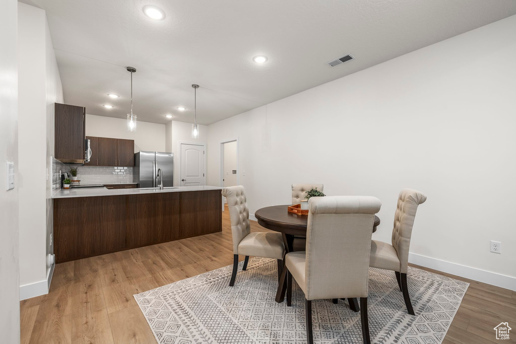 Dining area featuring light hardwood / wood-style flooring