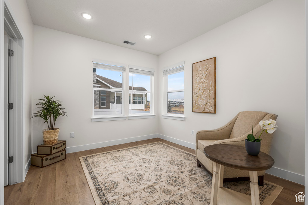 Living area featuring hardwood / wood-style floors