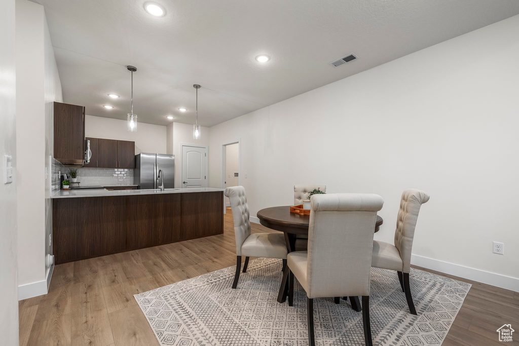 Dining room featuring light wood-type flooring