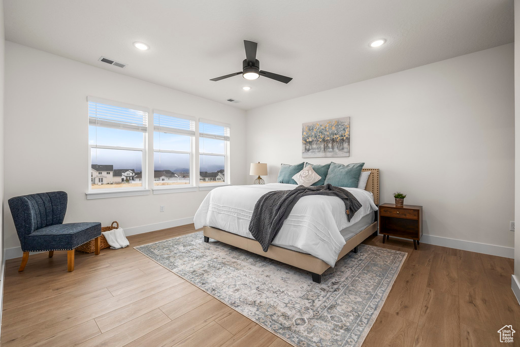 Bedroom featuring hardwood / wood-style flooring and ceiling fan