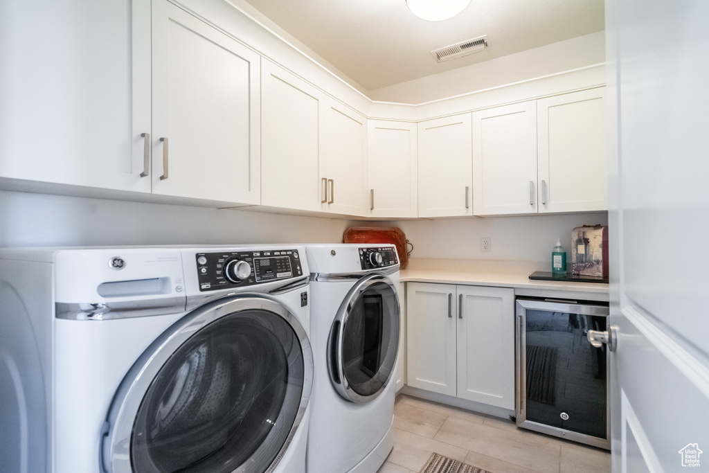 Washroom with beverage cooler and washer and dryer