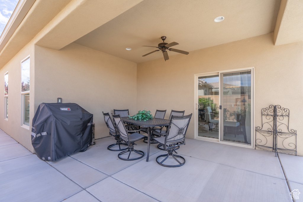 View of patio / terrace with ceiling fan and grilling area