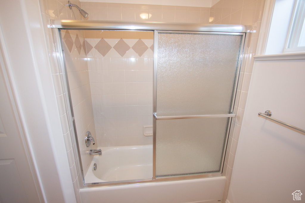 Bathroom with enclosed tub / shower combo