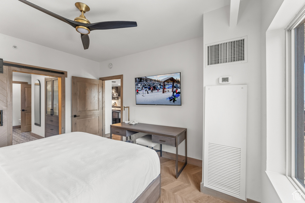 Bedroom featuring ceiling fan and light parquet flooring