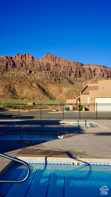 View of pool featuring a mountain view