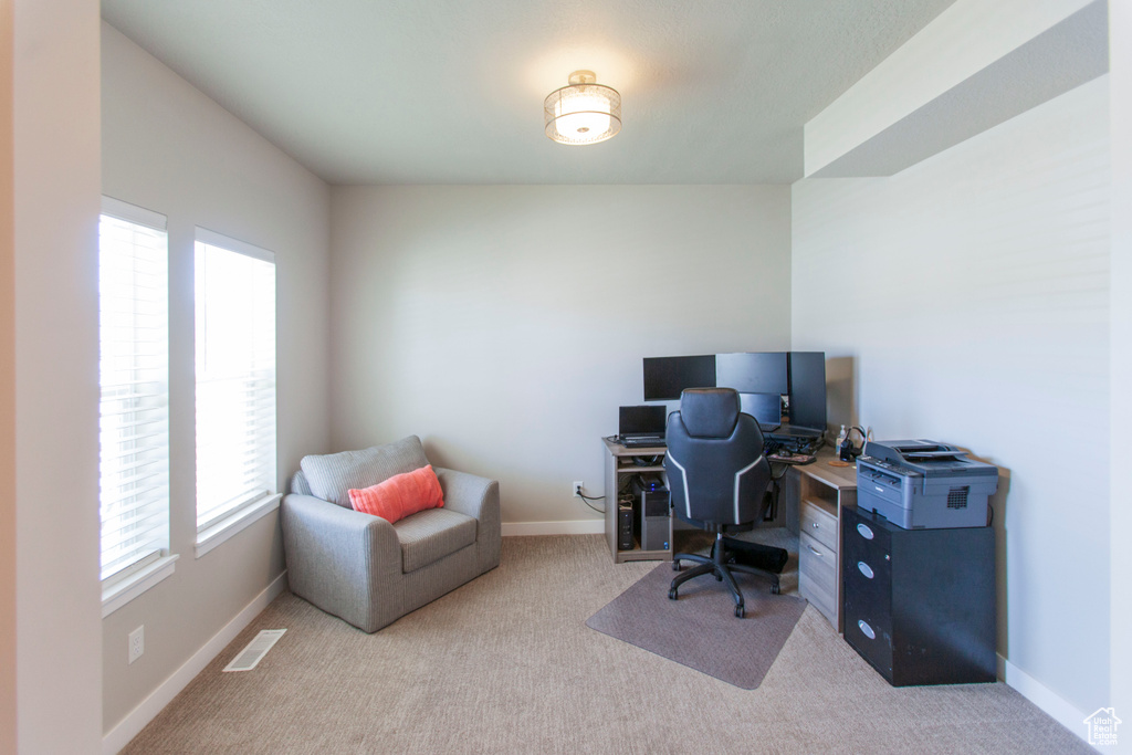 Office space with light colored carpet