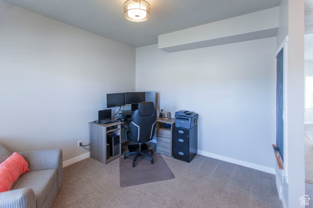 Home office featuring carpet flooring