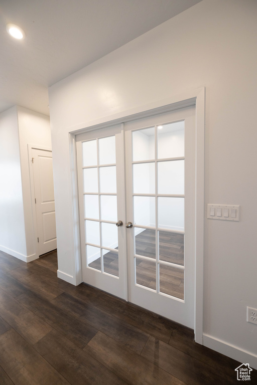 Room details with french doors and dark wood-type flooring