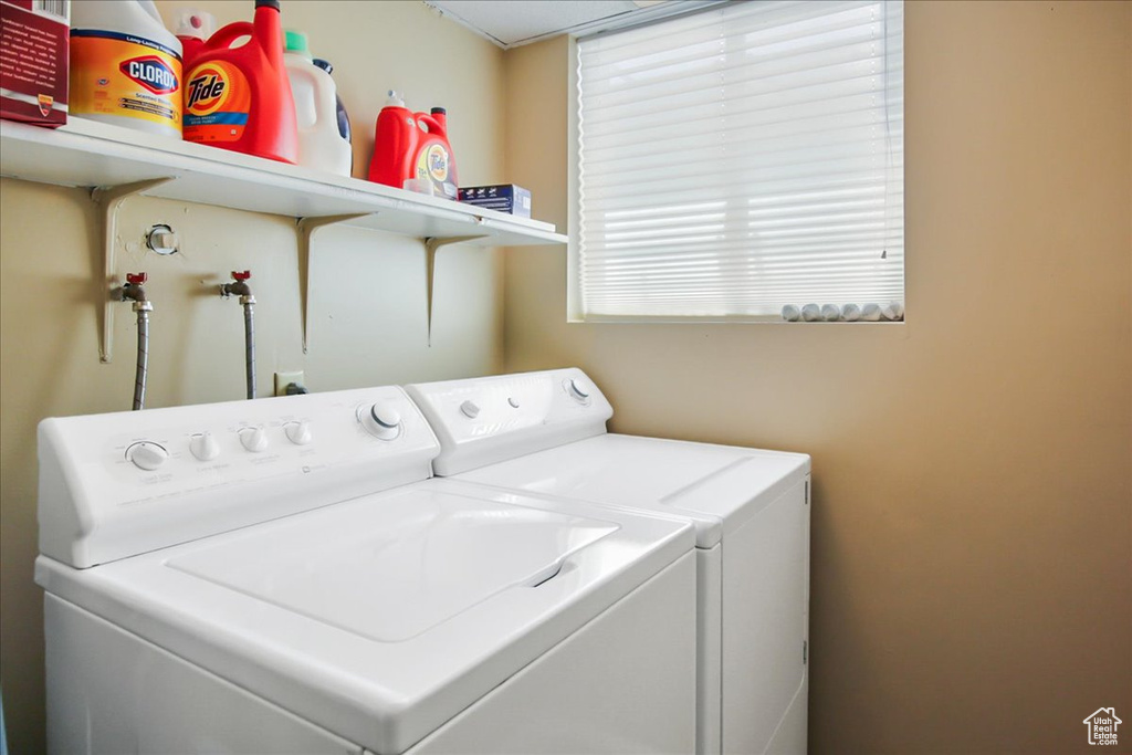 Washroom with washer and clothes dryer