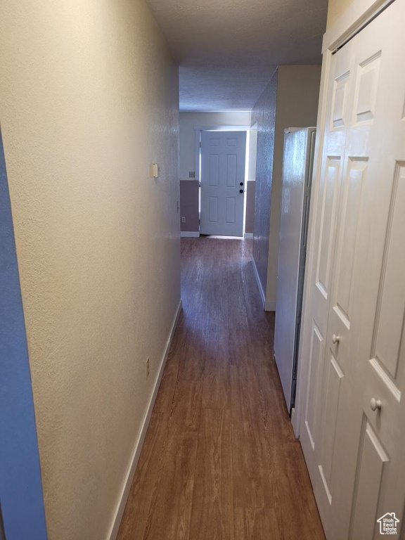 Corridor with dark wood-type flooring