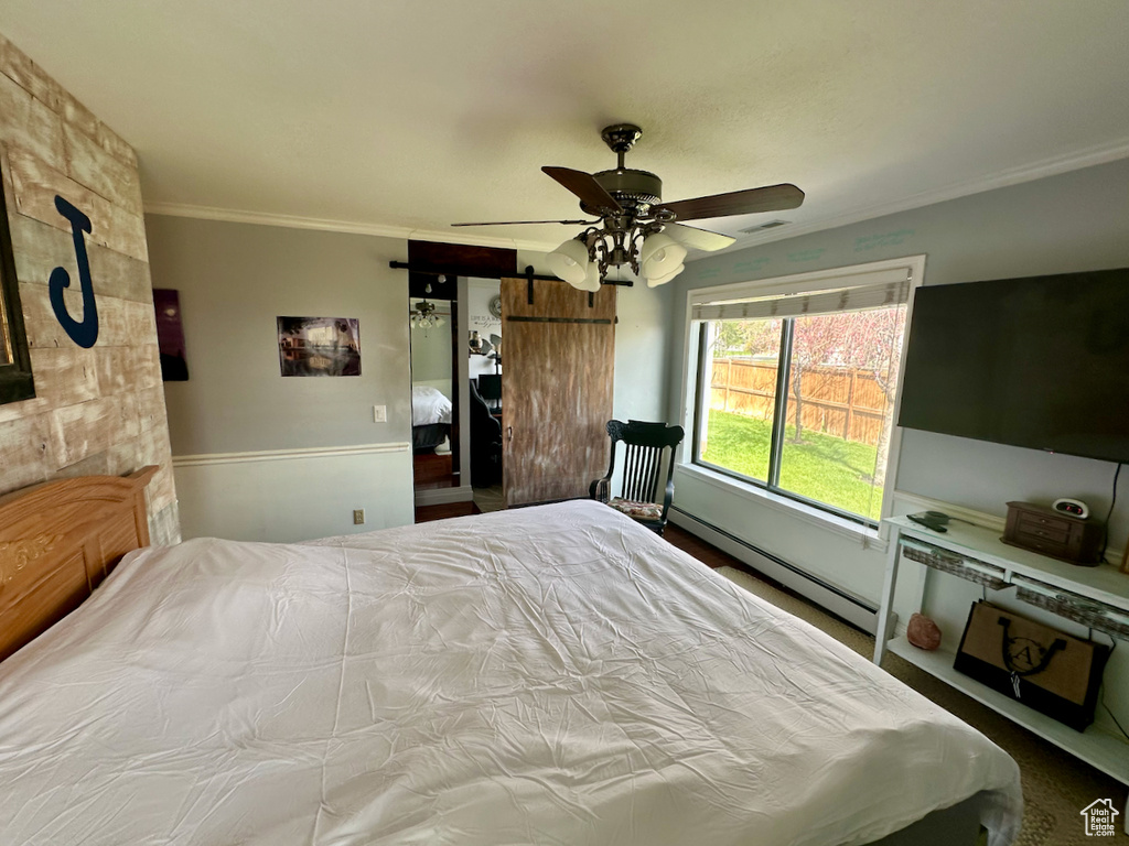Bedroom featuring baseboard heating and ceiling fan