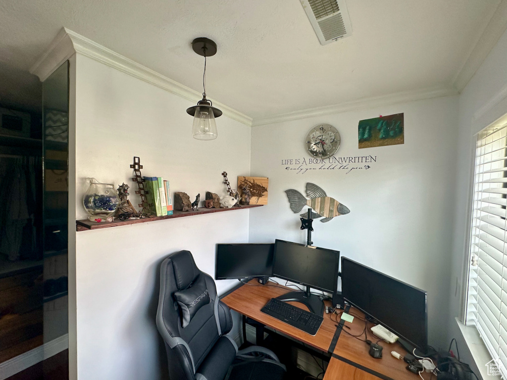 Office area featuring crown molding