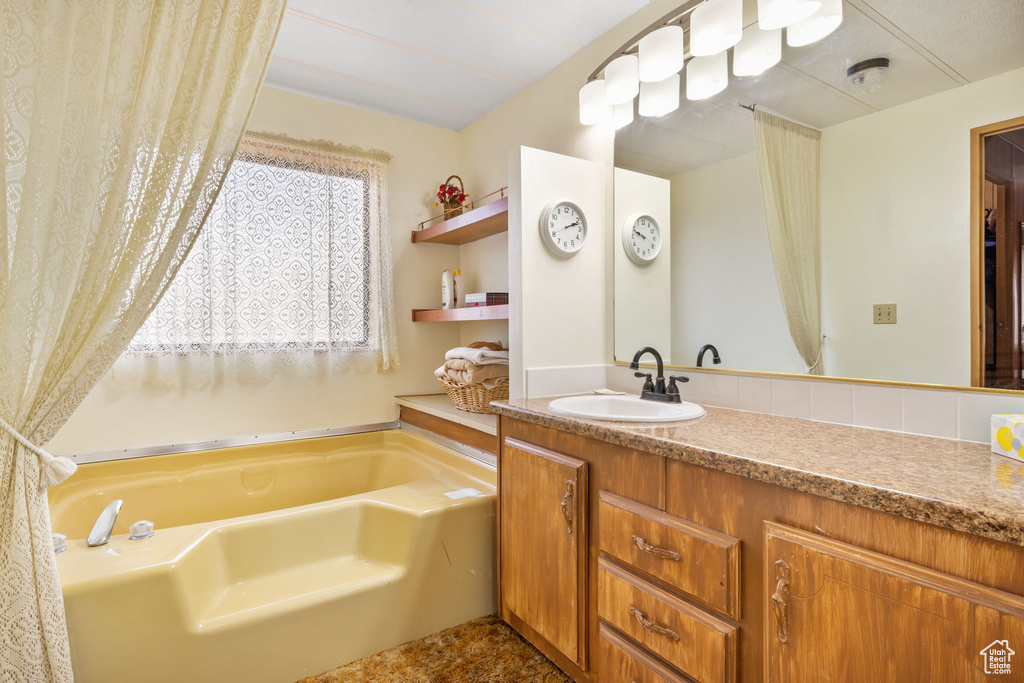 Bathroom with oversized vanity and a bathtub