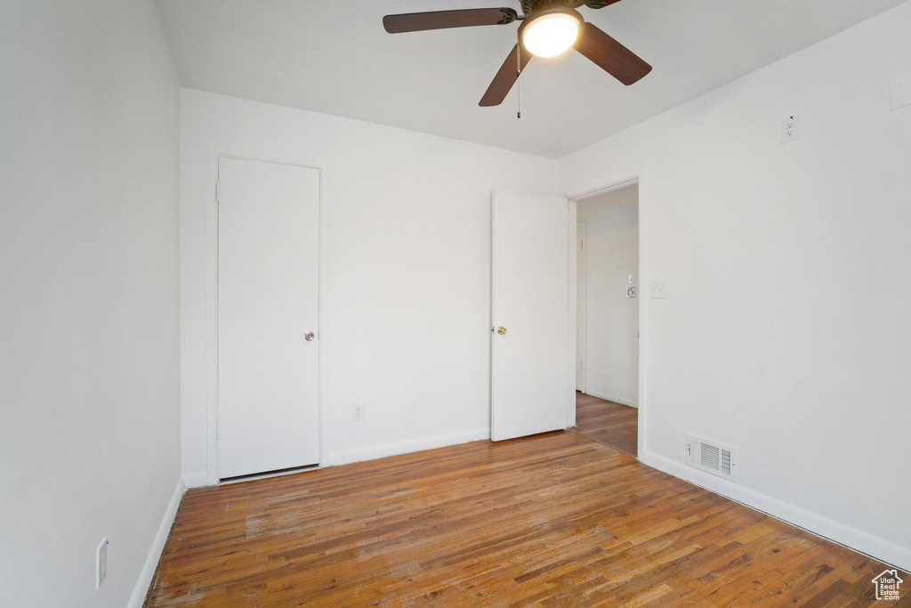 Unfurnished bedroom featuring ceiling fan and light wood-type flooring