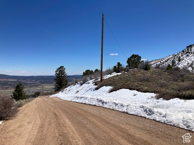 View of street with a rural view and a mountain view