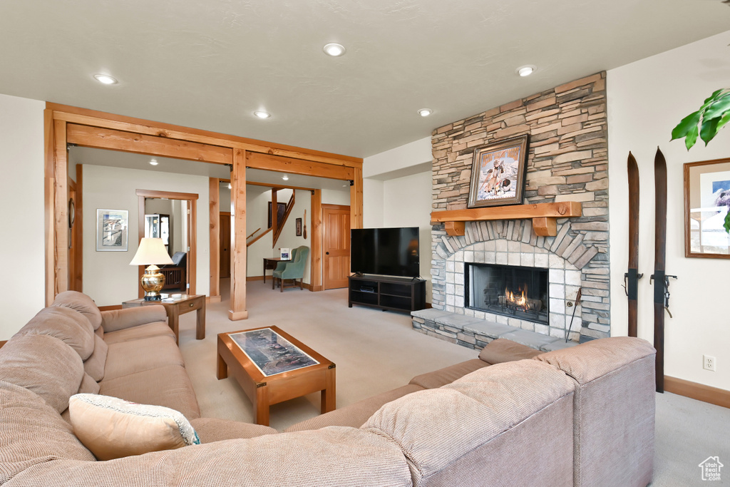 Carpeted living room with a fireplace