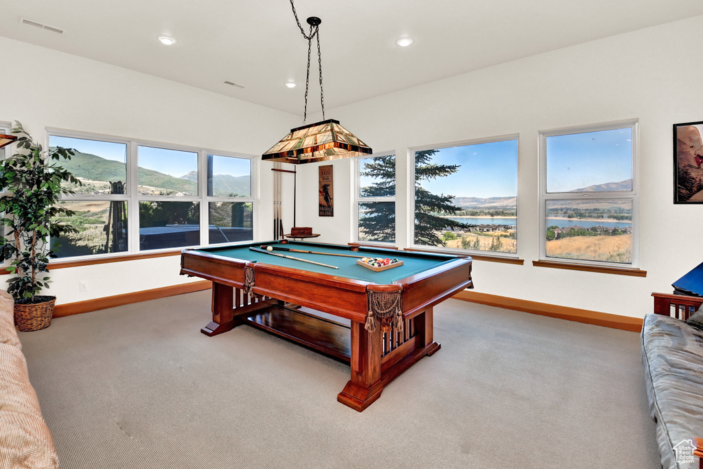 Game room with billiards, a mountain view, and light carpet