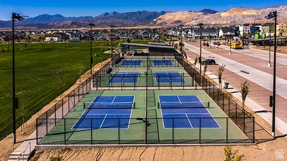 View of sport court featuring tennis court and a mountain view
