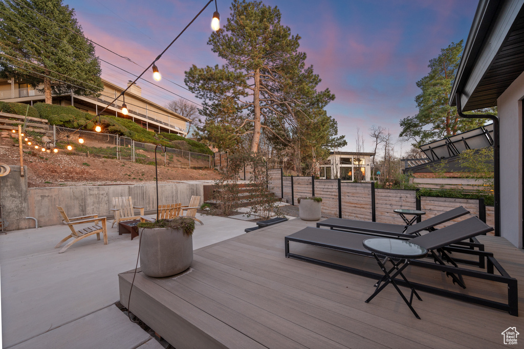Deck at dusk with a fire pit