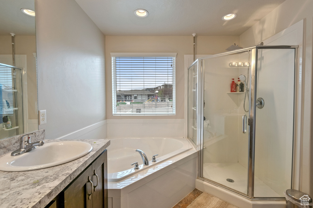 Bathroom with oversized vanity and plus walk in shower