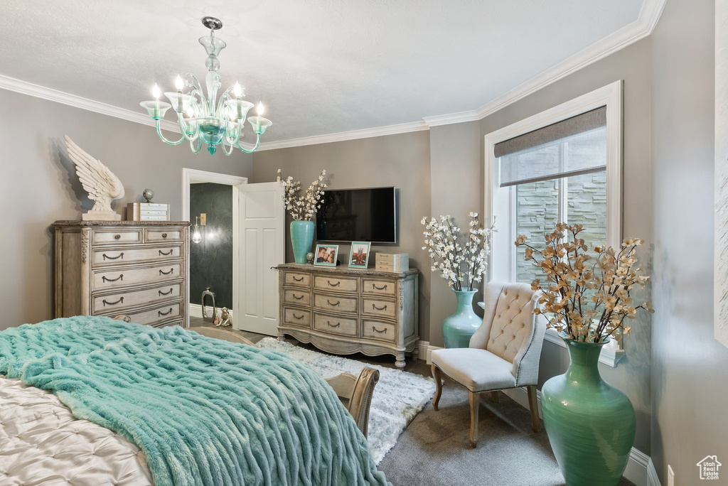 Bedroom featuring crown molding and a notable chandelier