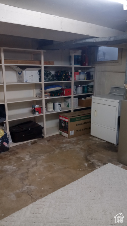 Storage area featuring washer / dryer