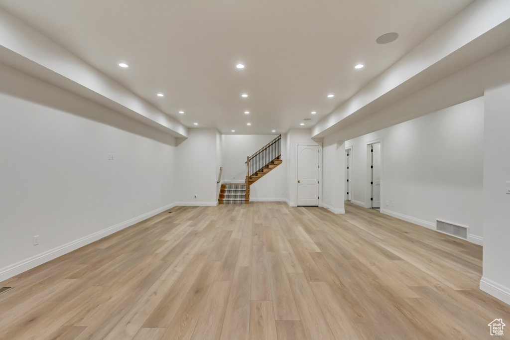 Basement featuring light hardwood / wood-style flooring