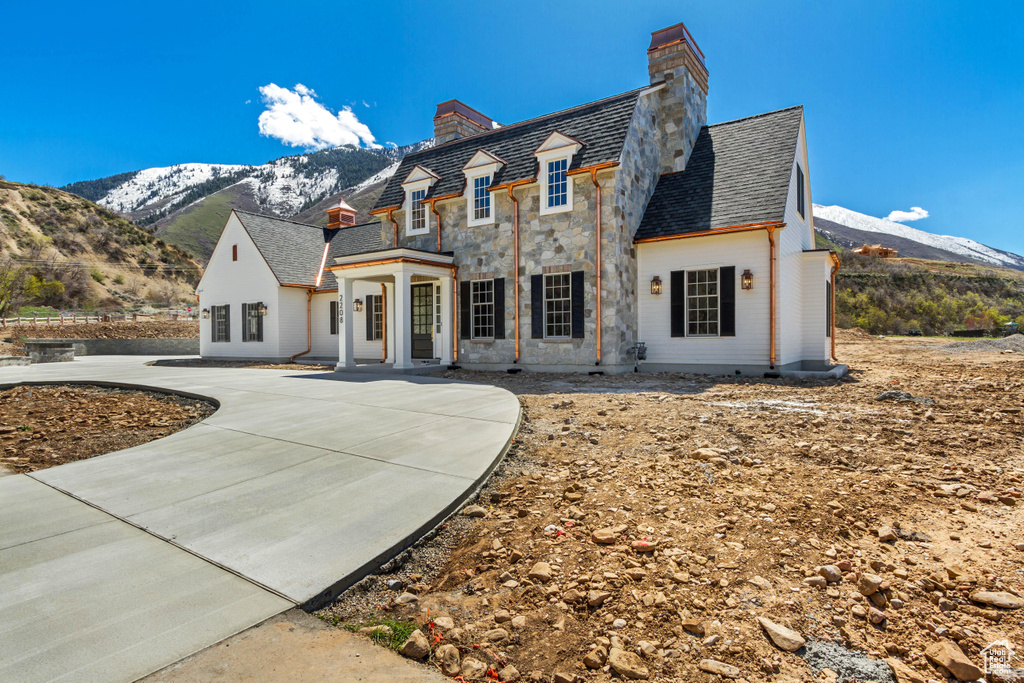 View of front of house featuring a mountain view and french doors
