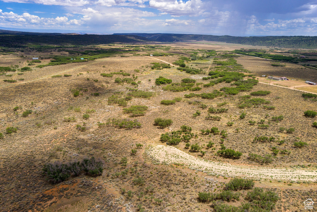 Birds eye view of property with a rural view