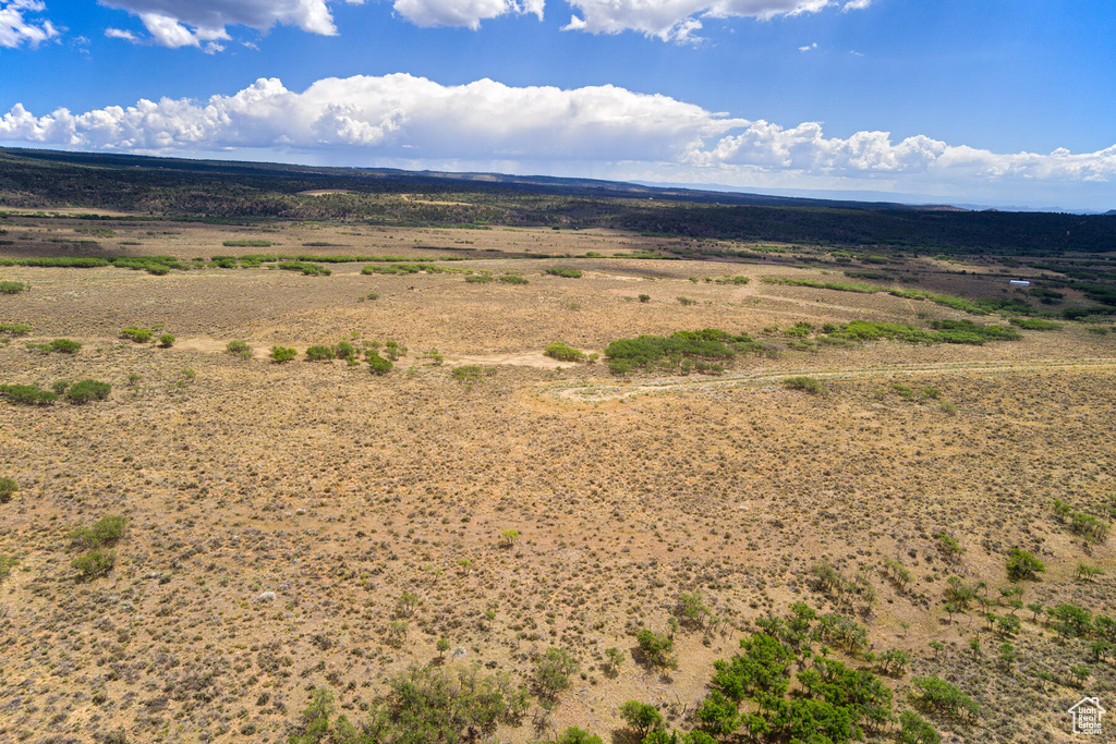 Birds eye view of property with a rural view