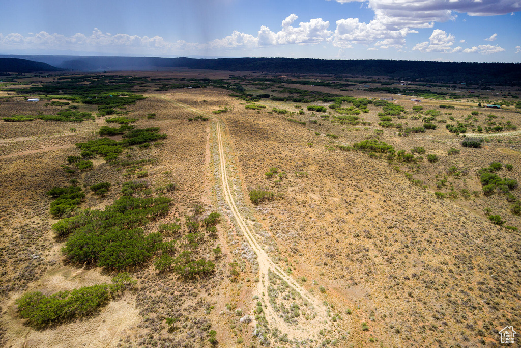 Birds eye view of property featuring a rural view