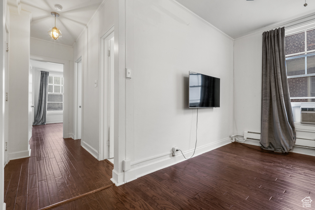 Interior space featuring dark hardwood / wood-style flooring and a baseboard radiator