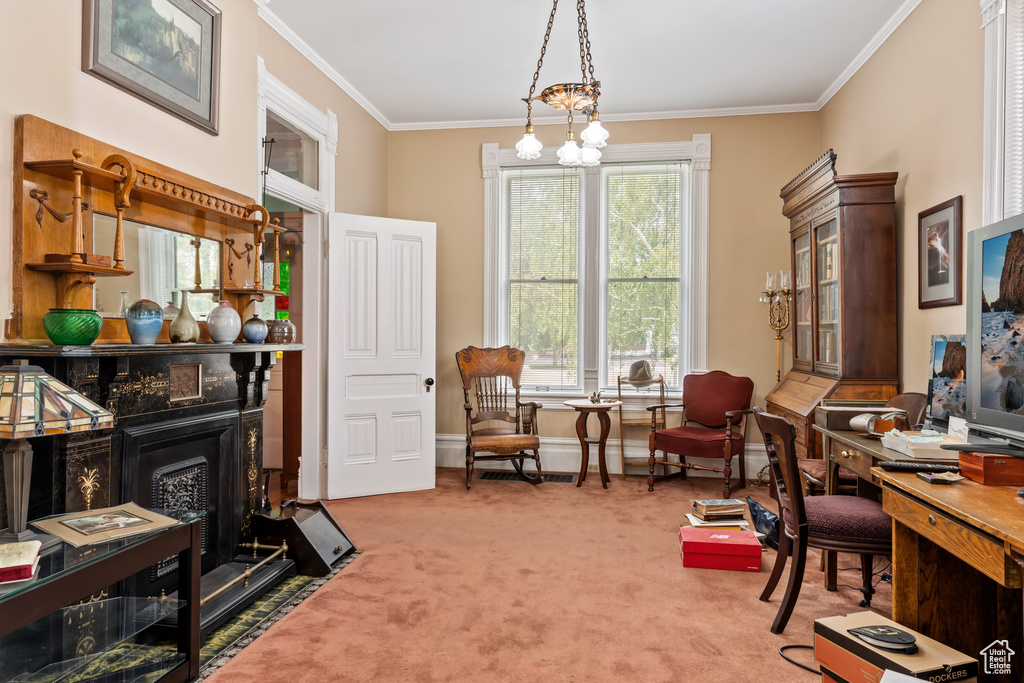 Carpeted home office with a notable chandelier and crown molding