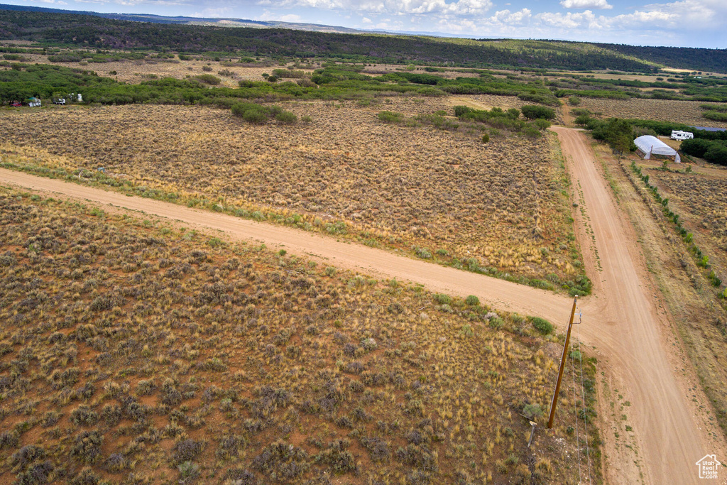 Birds eye view of property featuring a rural view