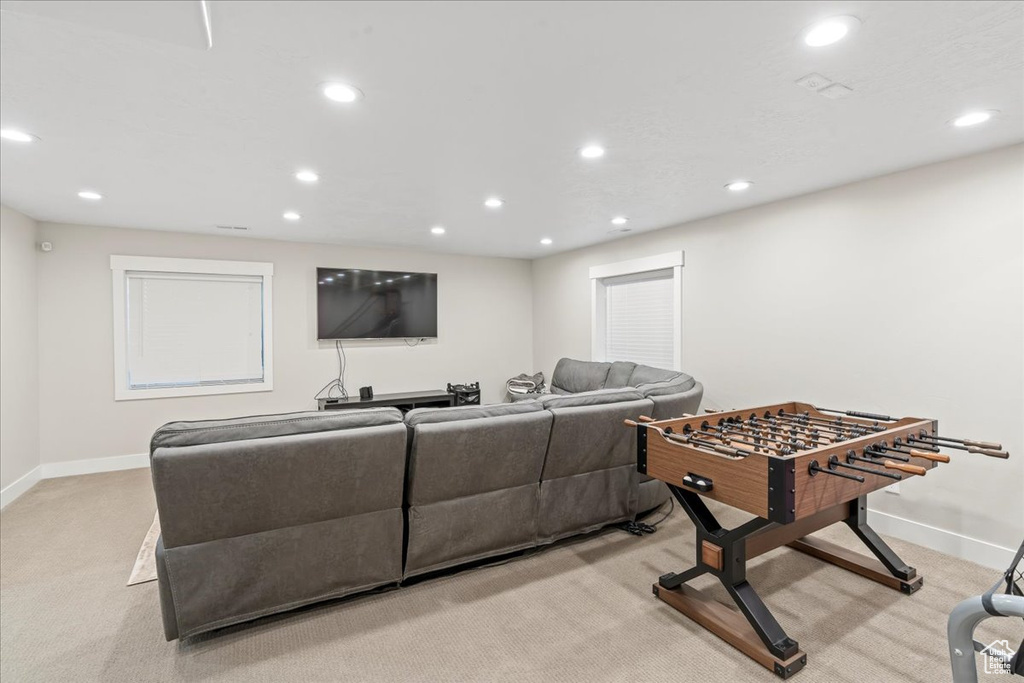 Game room with light colored carpet