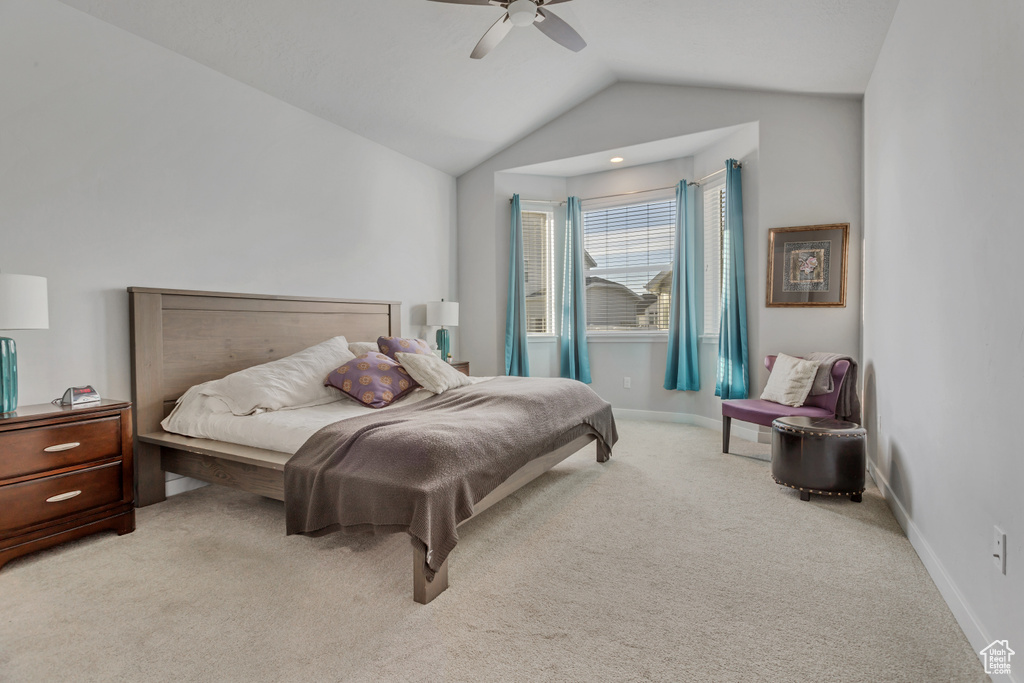 Bedroom with light carpet, lofted ceiling, and ceiling fan