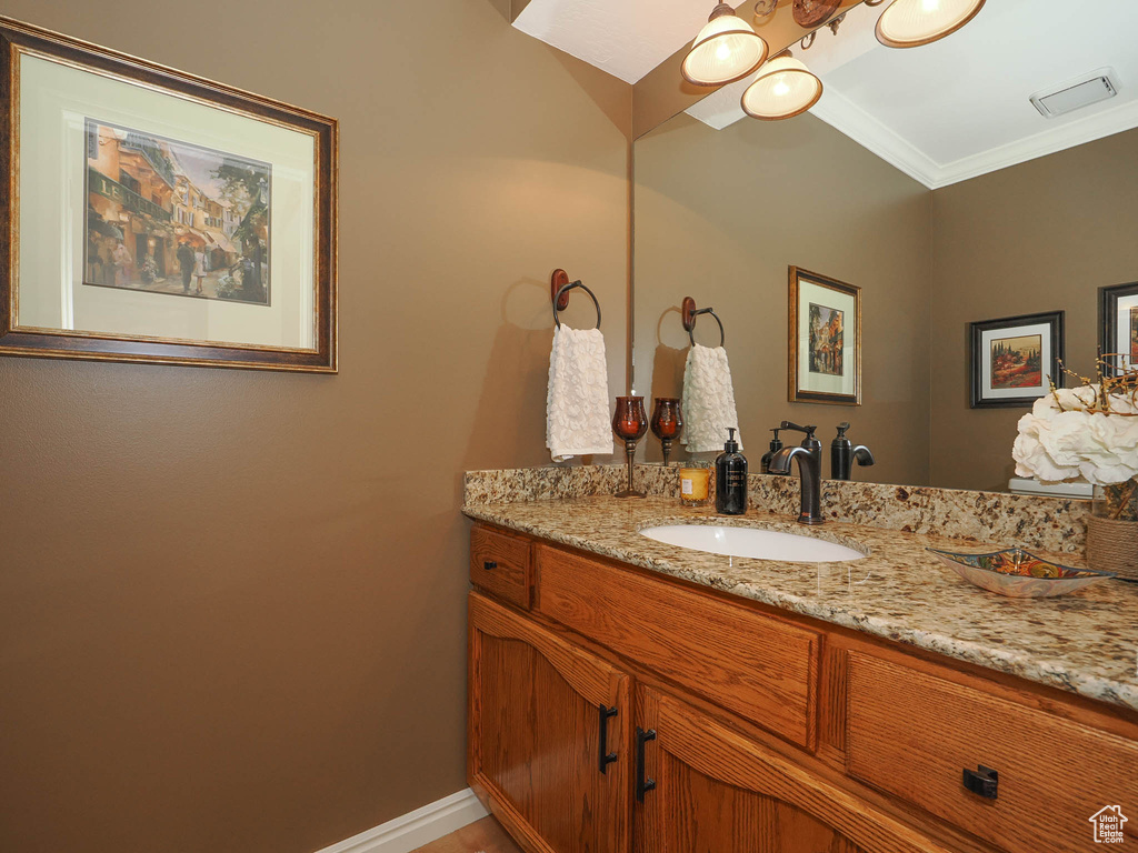 Bathroom with oversized vanity and crown molding