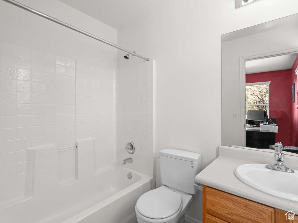 Full bathroom featuring toilet, vanity, and shower / bathtub combination