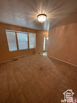Spare room with carpet flooring