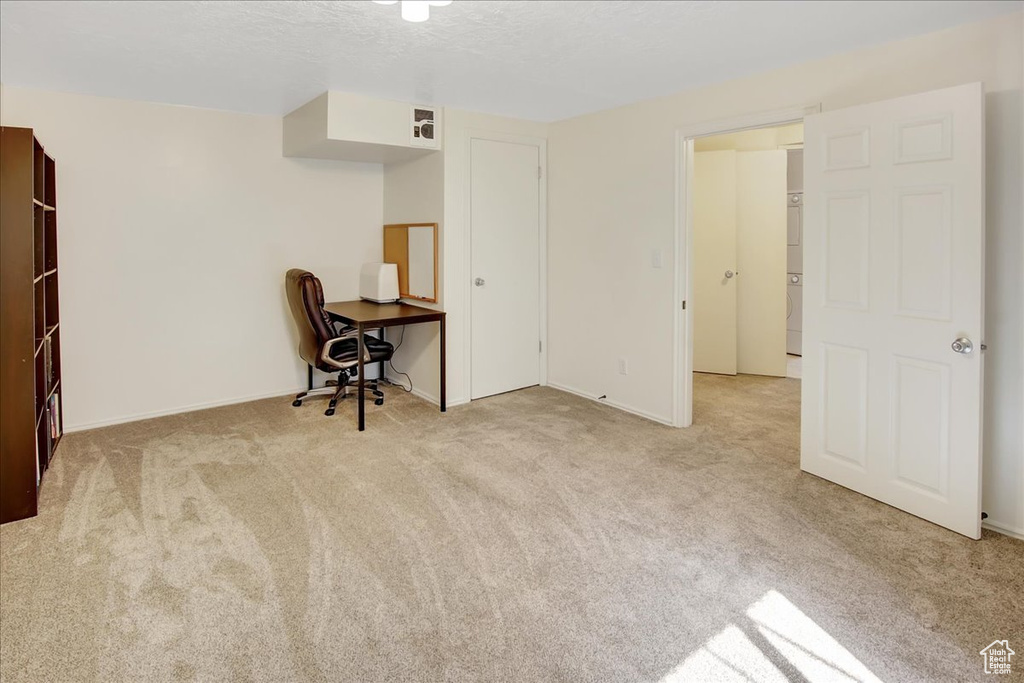 Unfurnished office with light colored carpet