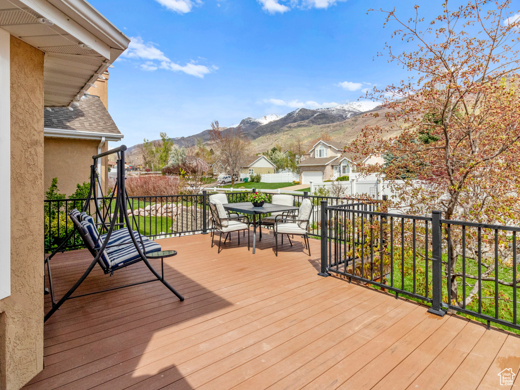 Wooden terrace featuring a mountain view