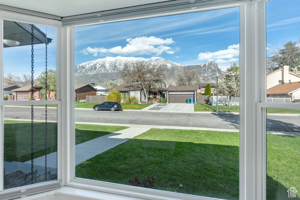Unfurnished sunroom with a mountain view
