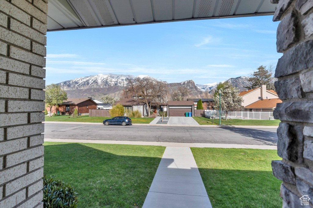 View of yard with a garage and a mountain view