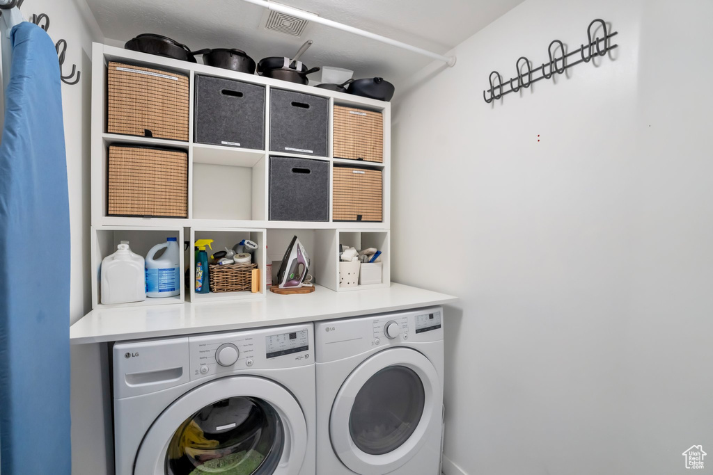 Clothes washing area with washing machine and clothes dryer