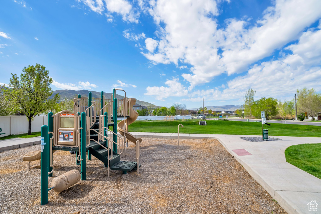 View of playground featuring a mountain view
