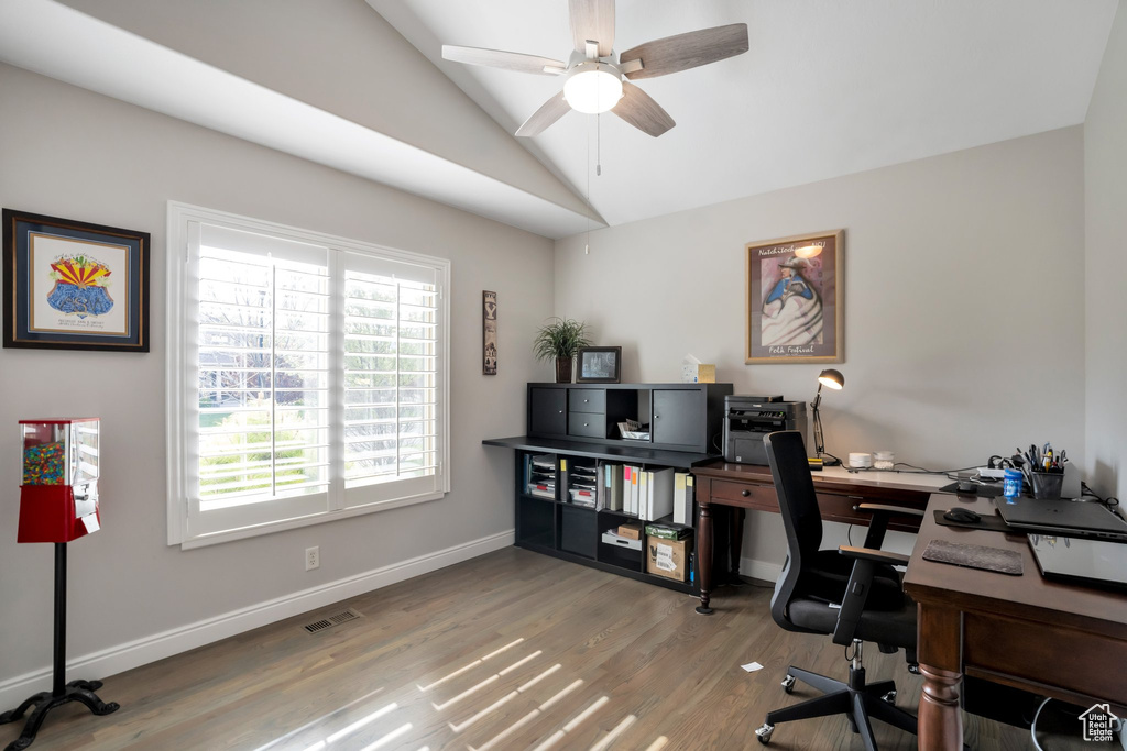 Office with vaulted ceiling, ceiling fan, and hardwood / wood-style flooring