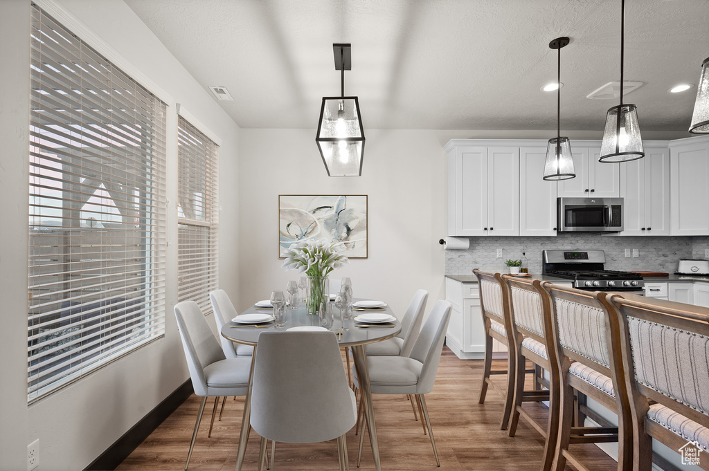 Dining space featuring dark hardwood / wood-style floors
