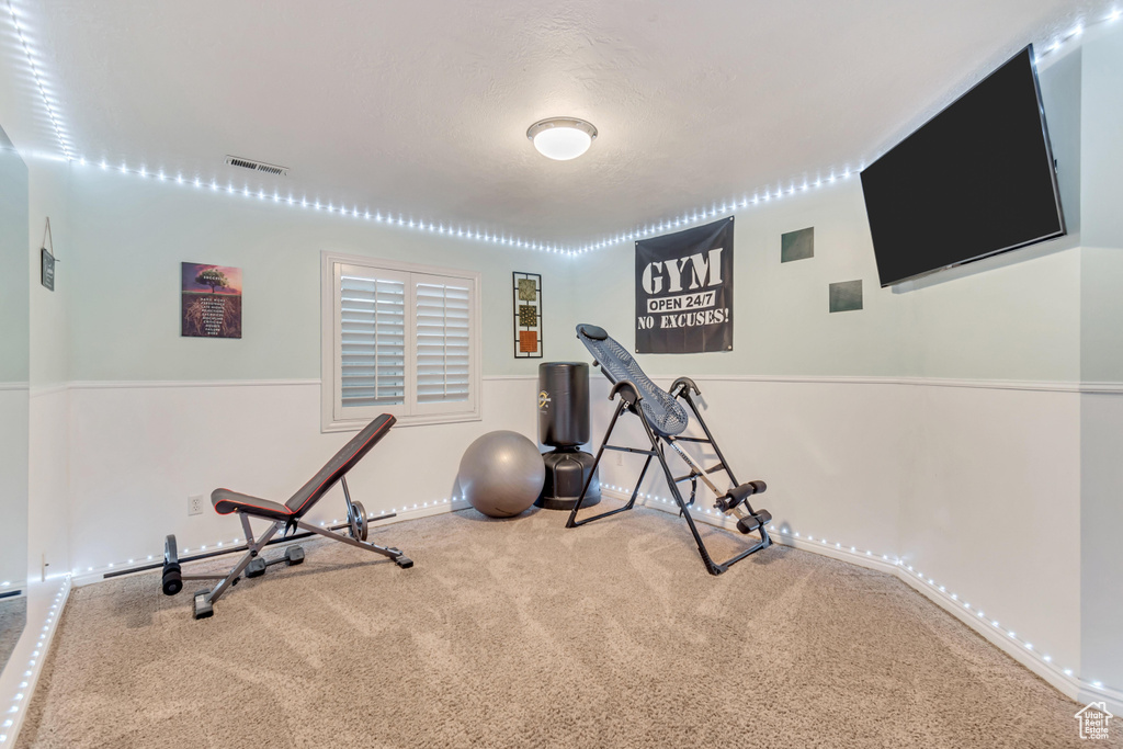 Workout area featuring carpet flooring