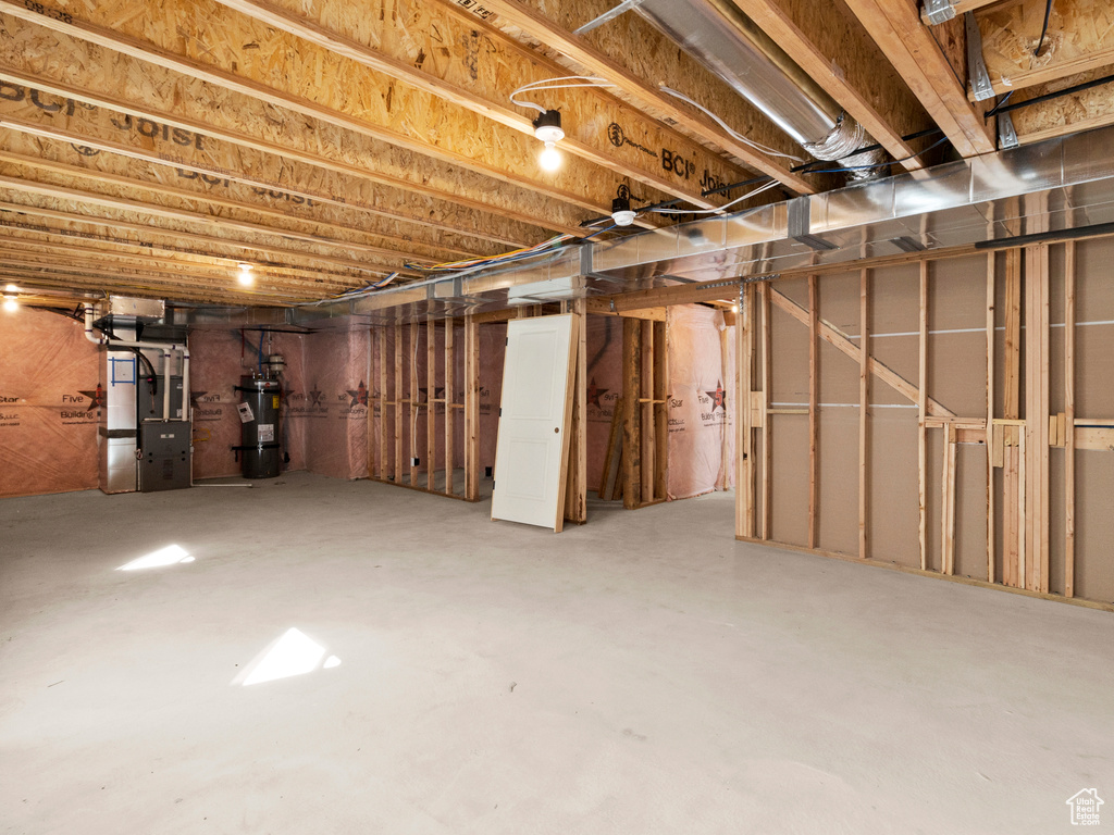 Basement with secured water heater and heating utilities