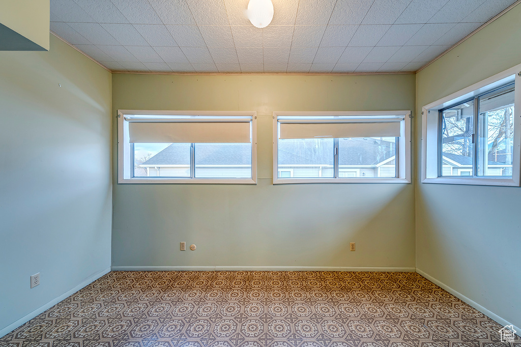 Empty room with light tile floors